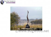 Heron on Rock in bog oak by Michael Casey