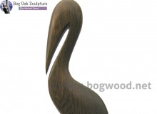 Pelican in bog oak by Michael Casey